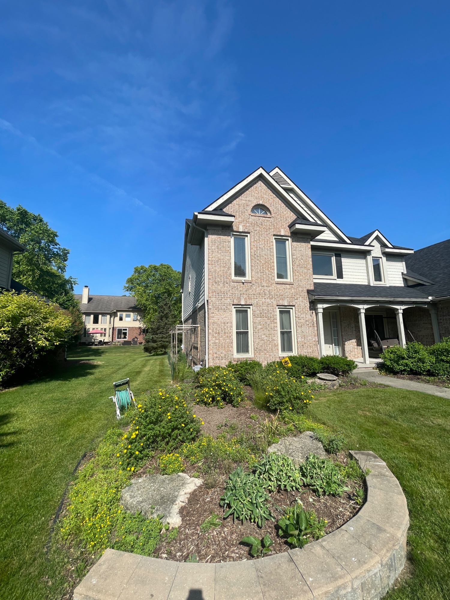 Before: weedy front island bed